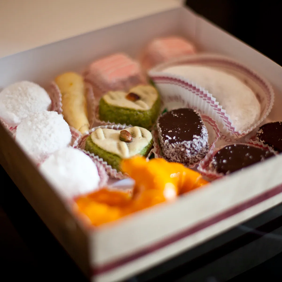Open gift box of assorted mithai
